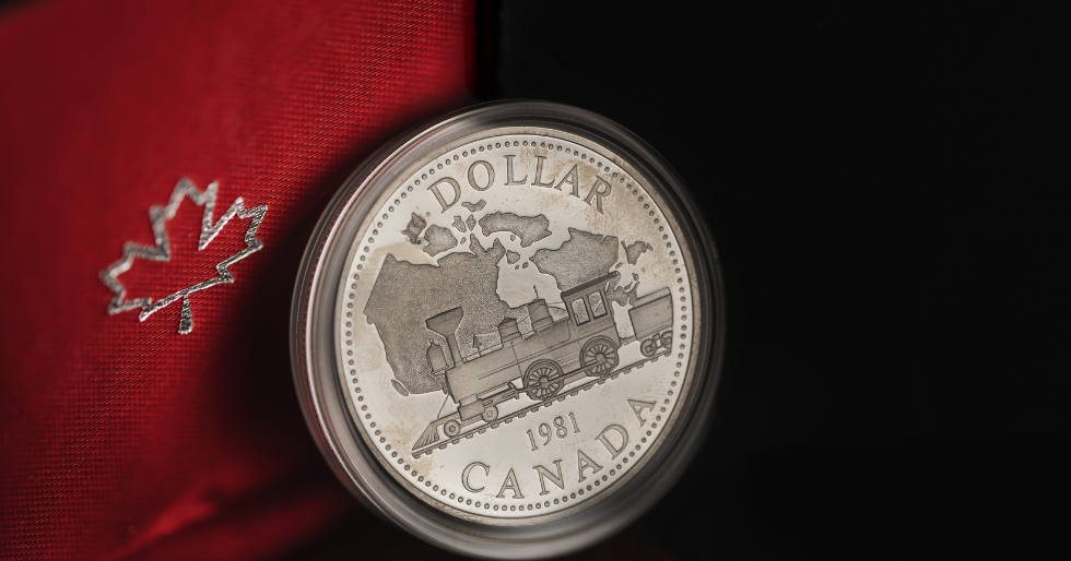 Politics Impact Investments blog and a photo of a Canadian dollar coin to represent the impact of Canadian and American politics of the Canadian economy and both traditional and alternative investments