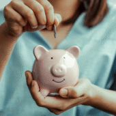 Alternative Investments in Registered Accounts woman holding a piggy bank to show the importance of effective savings and investing tactics.